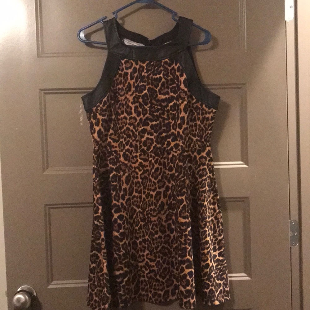 Brand New polyester/ spandex leopard print dress